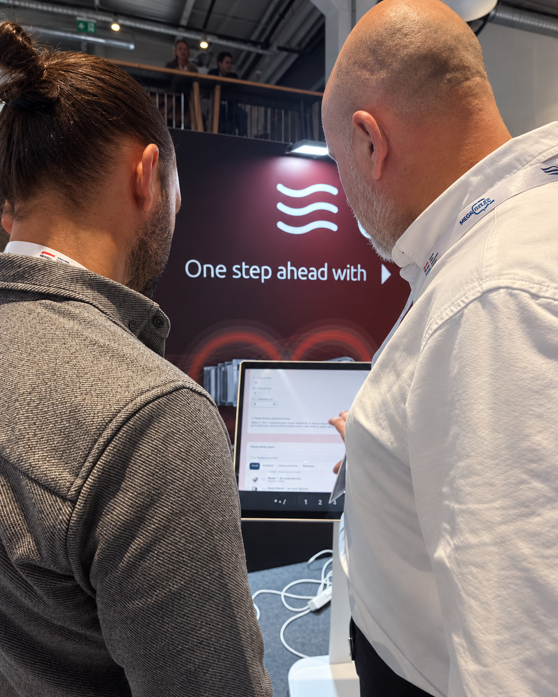 Reviewing information on screen at our stand.